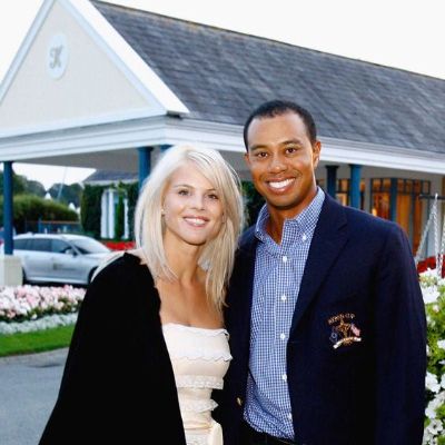 Tiger Woods and his former wife Elin Nordegren posing for a picture.
